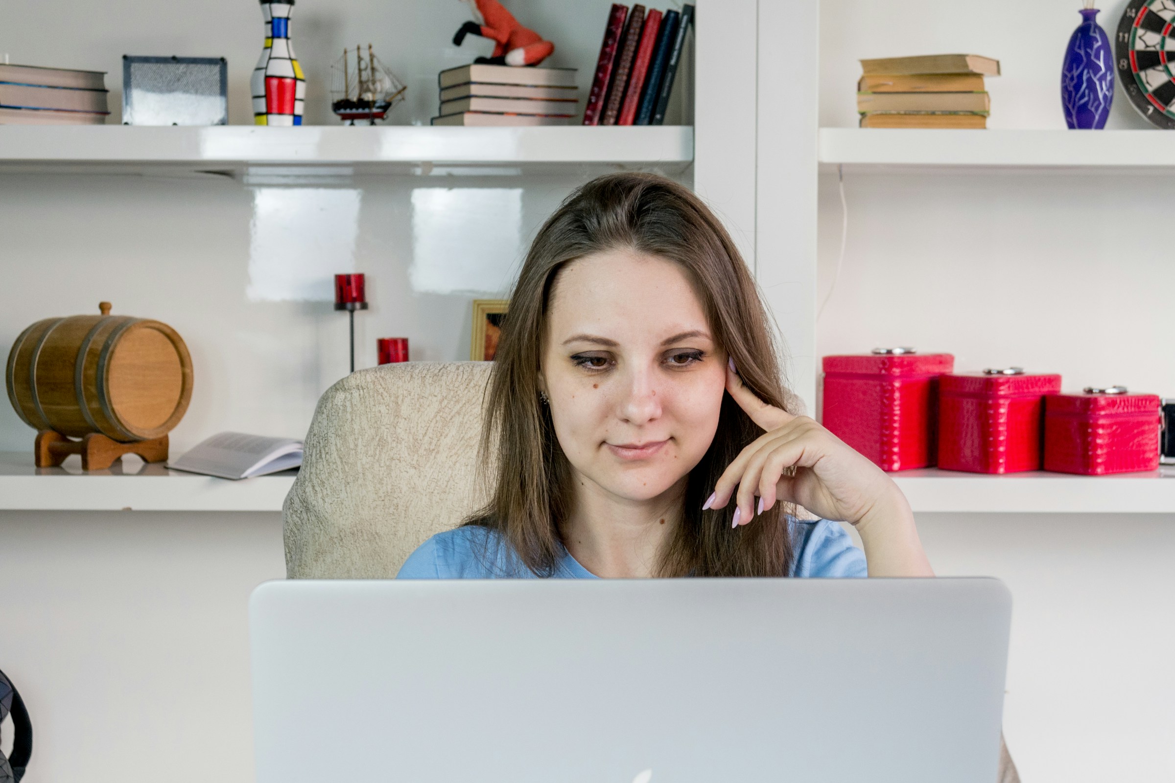 woman working on a laptop - What Is A Prop Firm Challenge