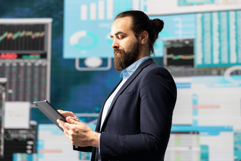 man holding a tablet - Best Time Frame for Day Trading