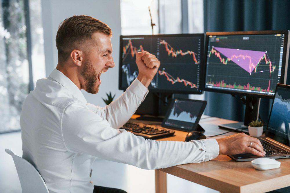 man looking happy and trading - How Much Can You Make Day Trading With 100K