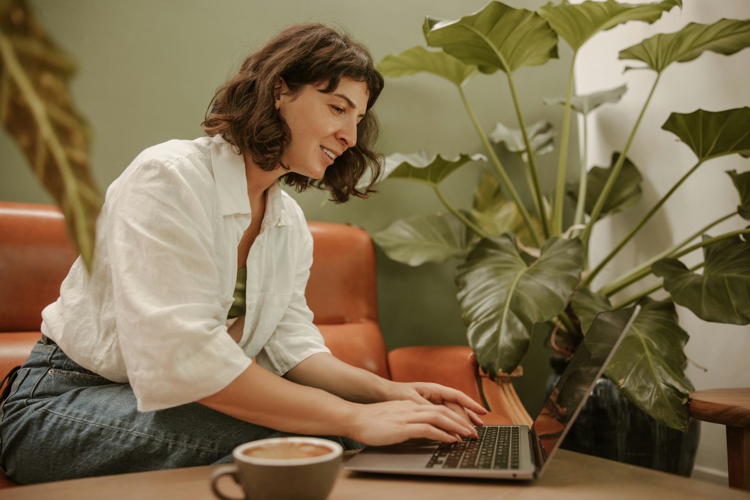 woman working on a laptop - What Is A Prop Firm Challenge
