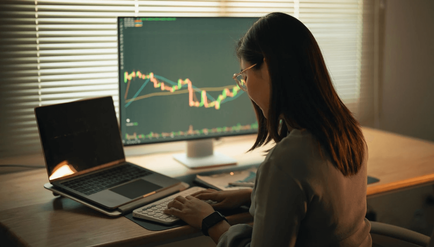 Woman analyzing market data on screens - Forex Trading Profit Per Day