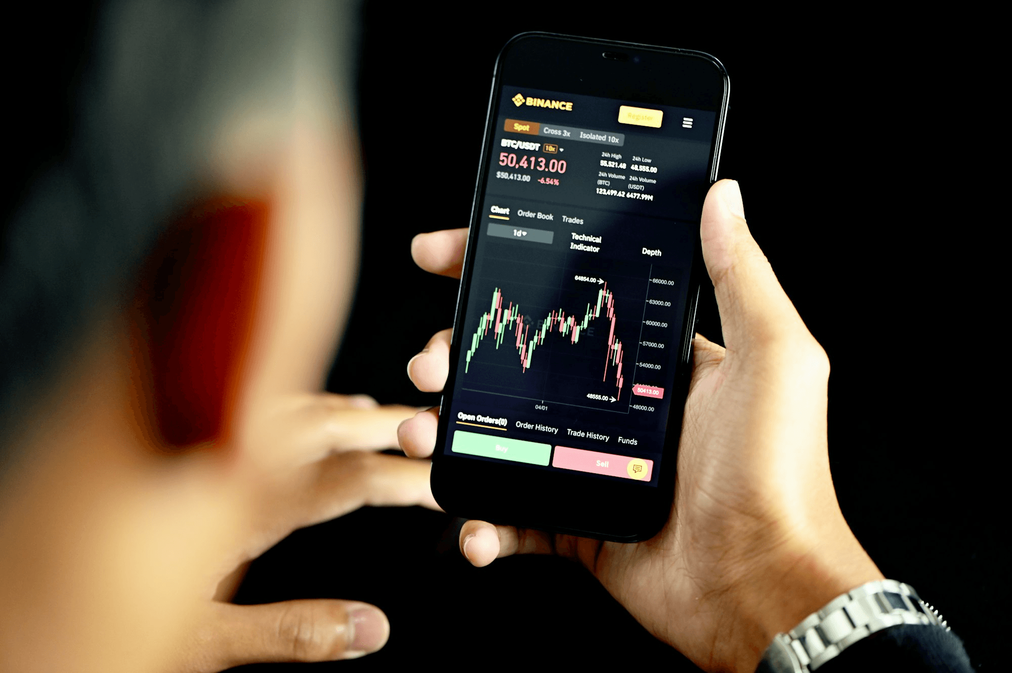  Person viewing cryptocurrency trading on smartphone - Crypto Swing Trading Strategy