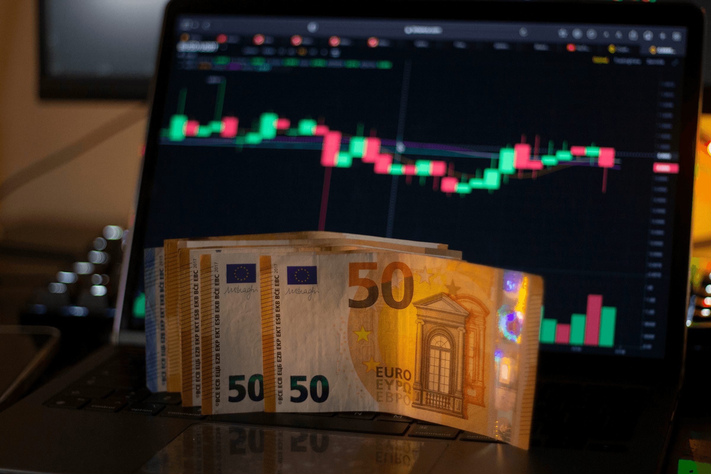 Euro bills in front of trading - No Challenge Prop Firm