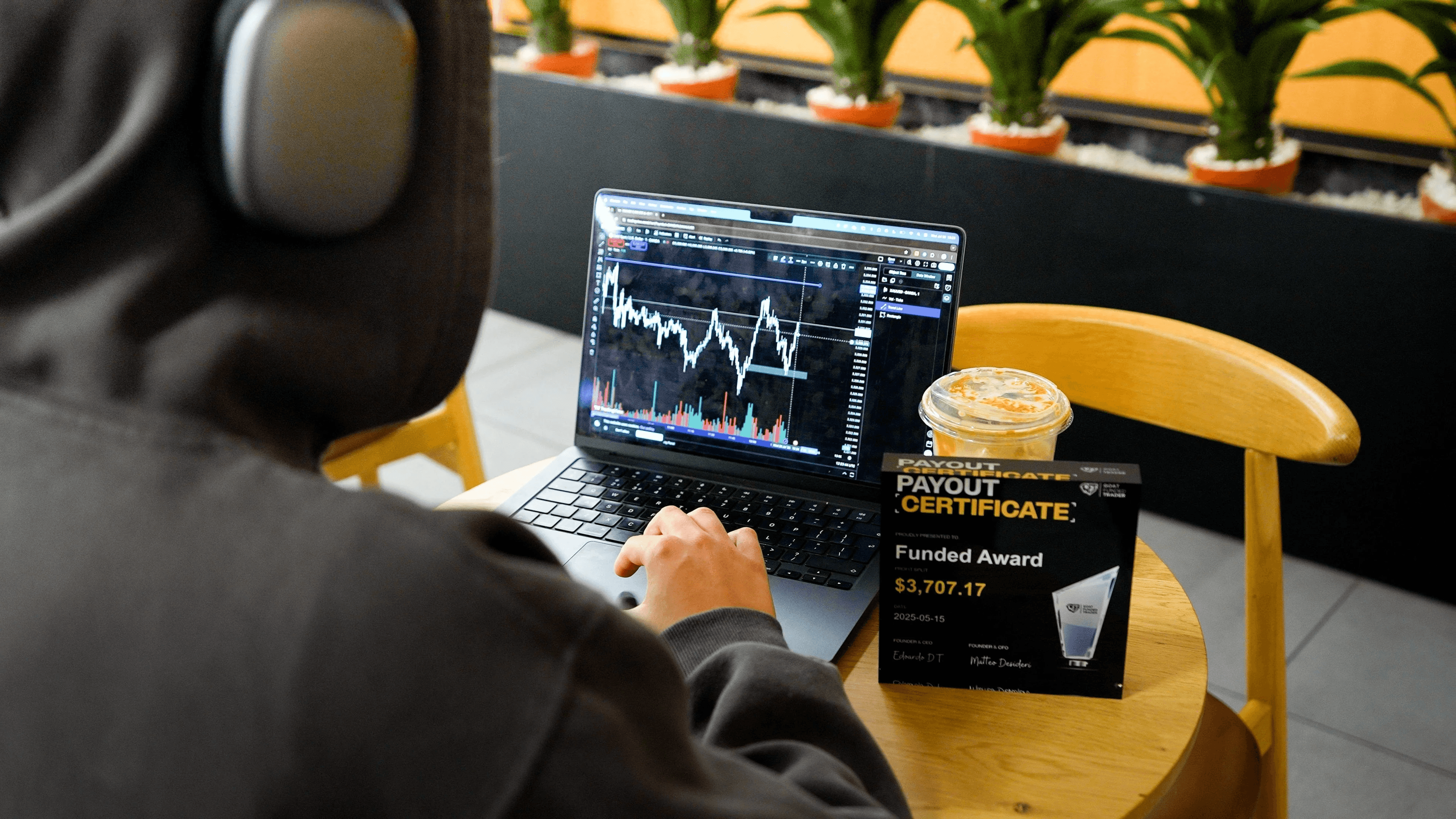 Trader viewing charts and payout award -  Prop Firms in the USA