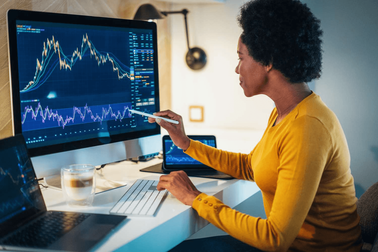 woman analyzing a candle stick chart - Why Trade Futures Instead Of Options