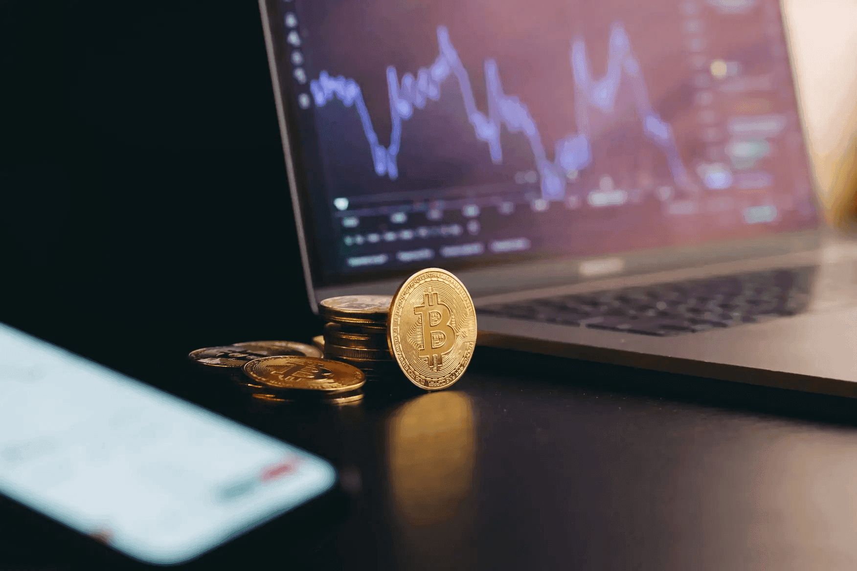 Bitcoin coins beside laptop - Futures Trading Tips