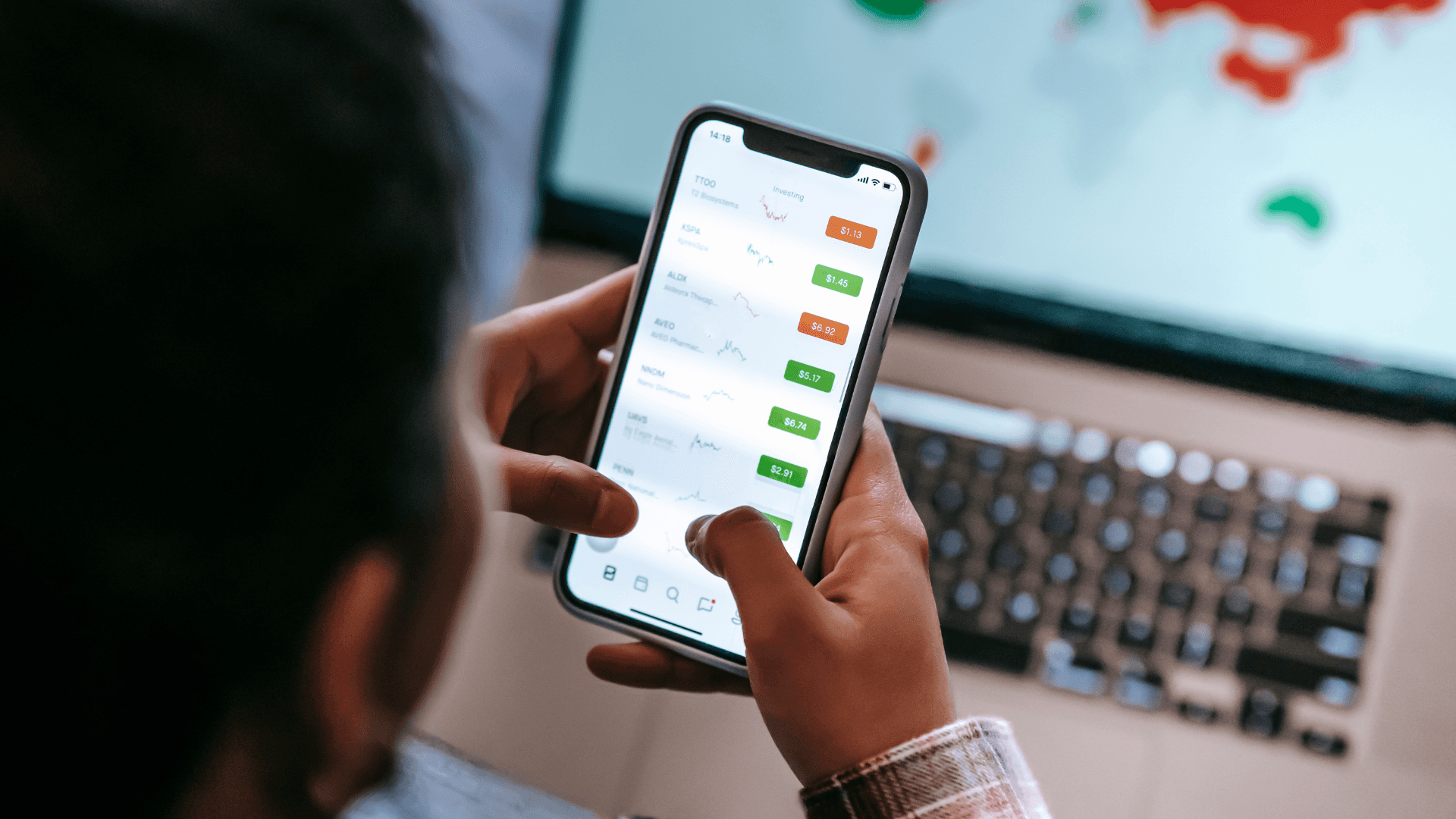 Person using stock portfolio app - Can You Hold Futures Overnight
