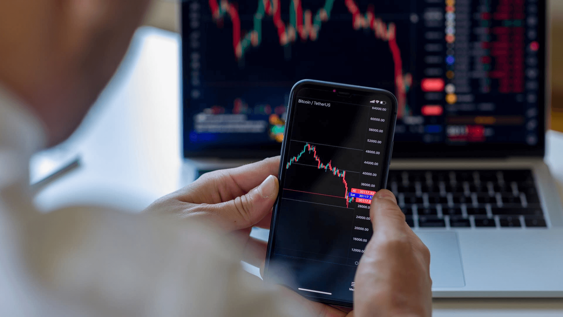 Person monitoring financial market trading charts - Calendar Spread Margin Benefit