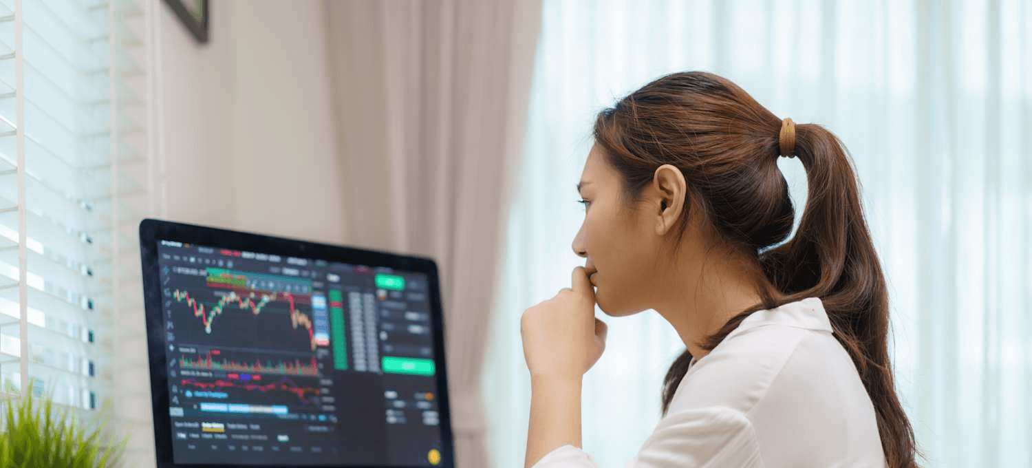 Woman monitoring stock charts - How to Trade Micro Futures