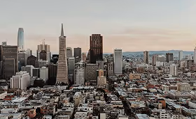 Panoramic view of the San Francisco skyline at dusk featuring the Transamerica Pyramid and Salesforce Tower, representing a major West Coast healthcare and research market.