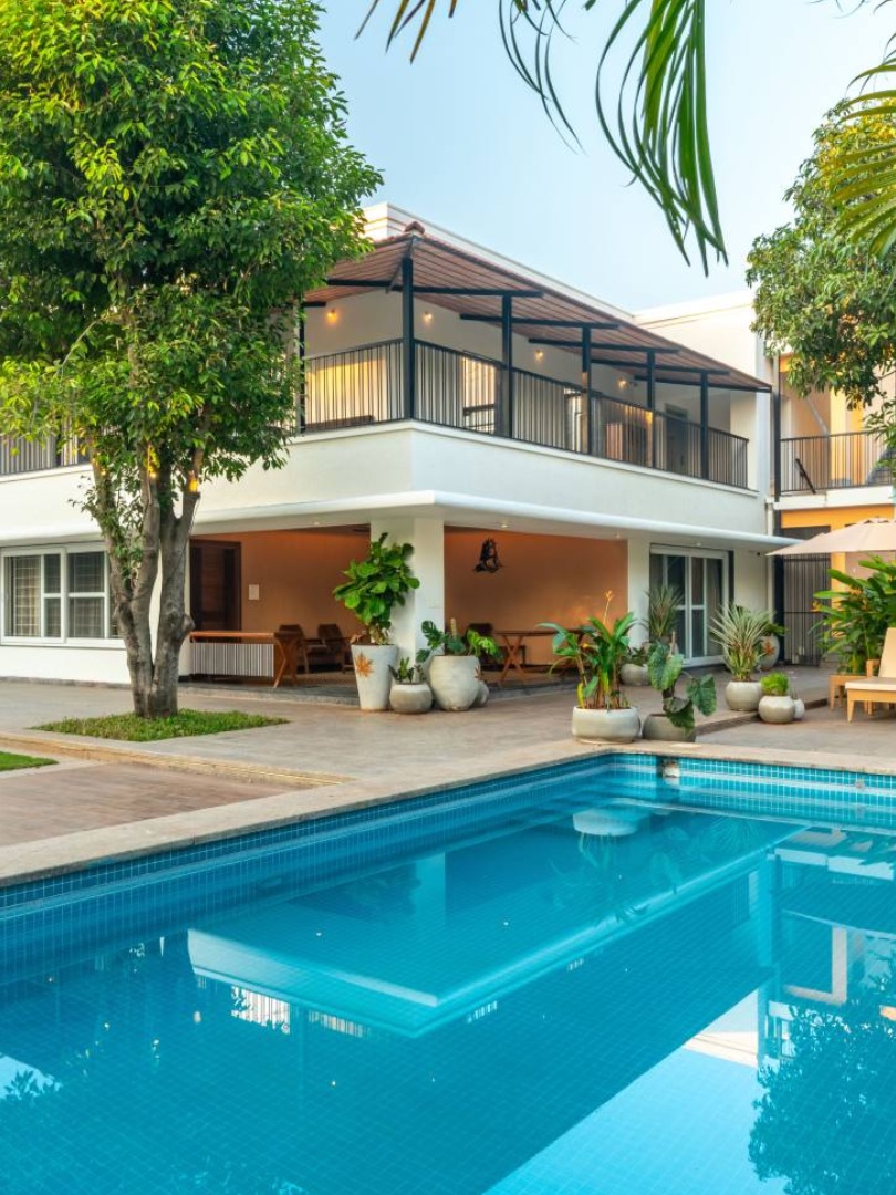 Sri Narayana Vanam luxury farmhouse vacation rental with private swimming pool, lawn, and outdoor lounge area at Survey no 129, Aziznagar, Moinabad, Hyderabad - Ideal for family stays and intimate weddings.