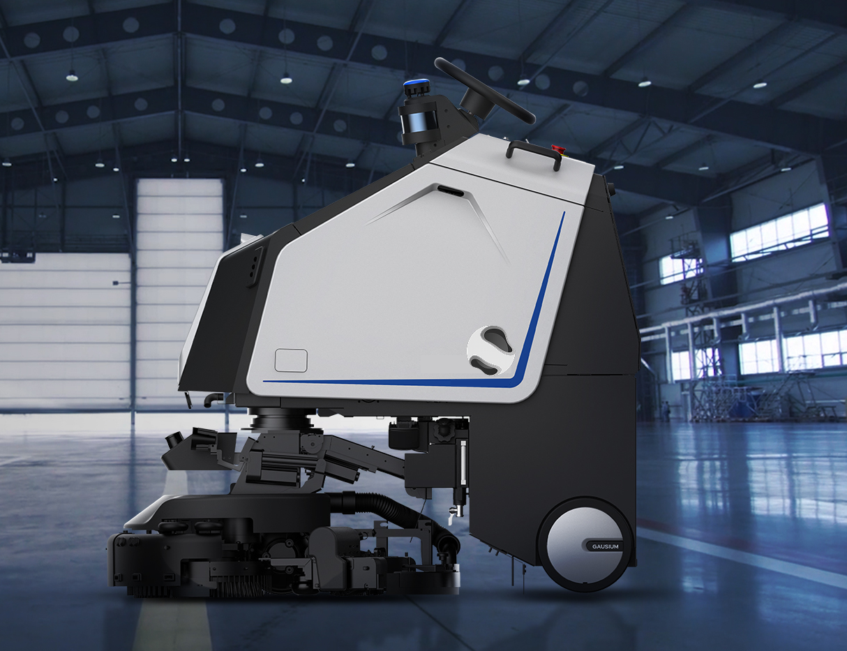 Machine de nettoyage industrielle autonome de couleur grise et noire dans un grand entrepôt.