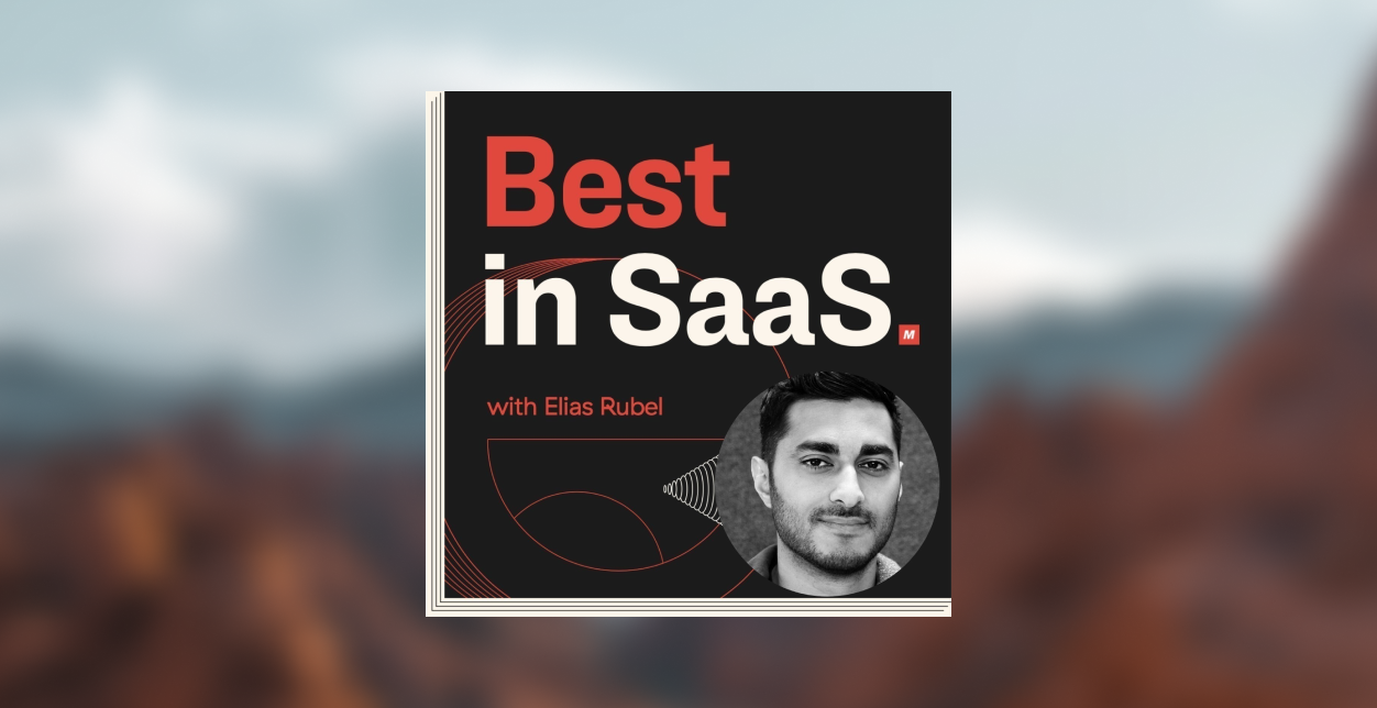 A large, lively crowd seen from above with raised arms at an outdoor event, capturing an energetic and festive atmosphere under bright lighting.