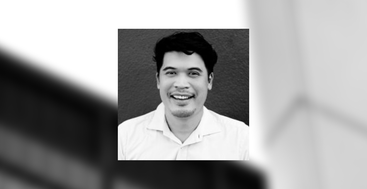 Close-up of a digital screen displaying fluctuating stock market graphs in green and pink on a blurred background, conveying a sense of dynamic motion.