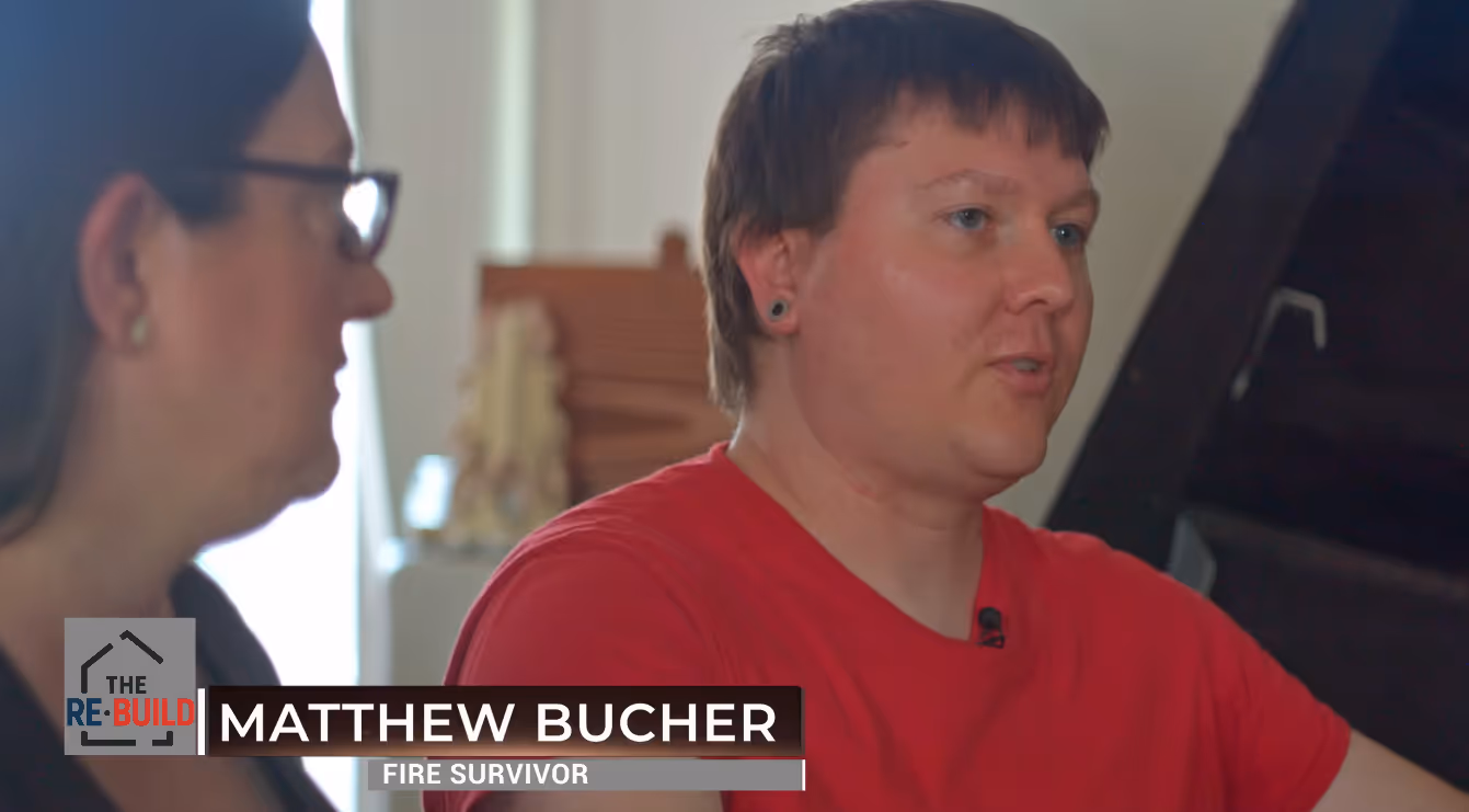 image of a remembrance candle burning softly on a polished wooden table