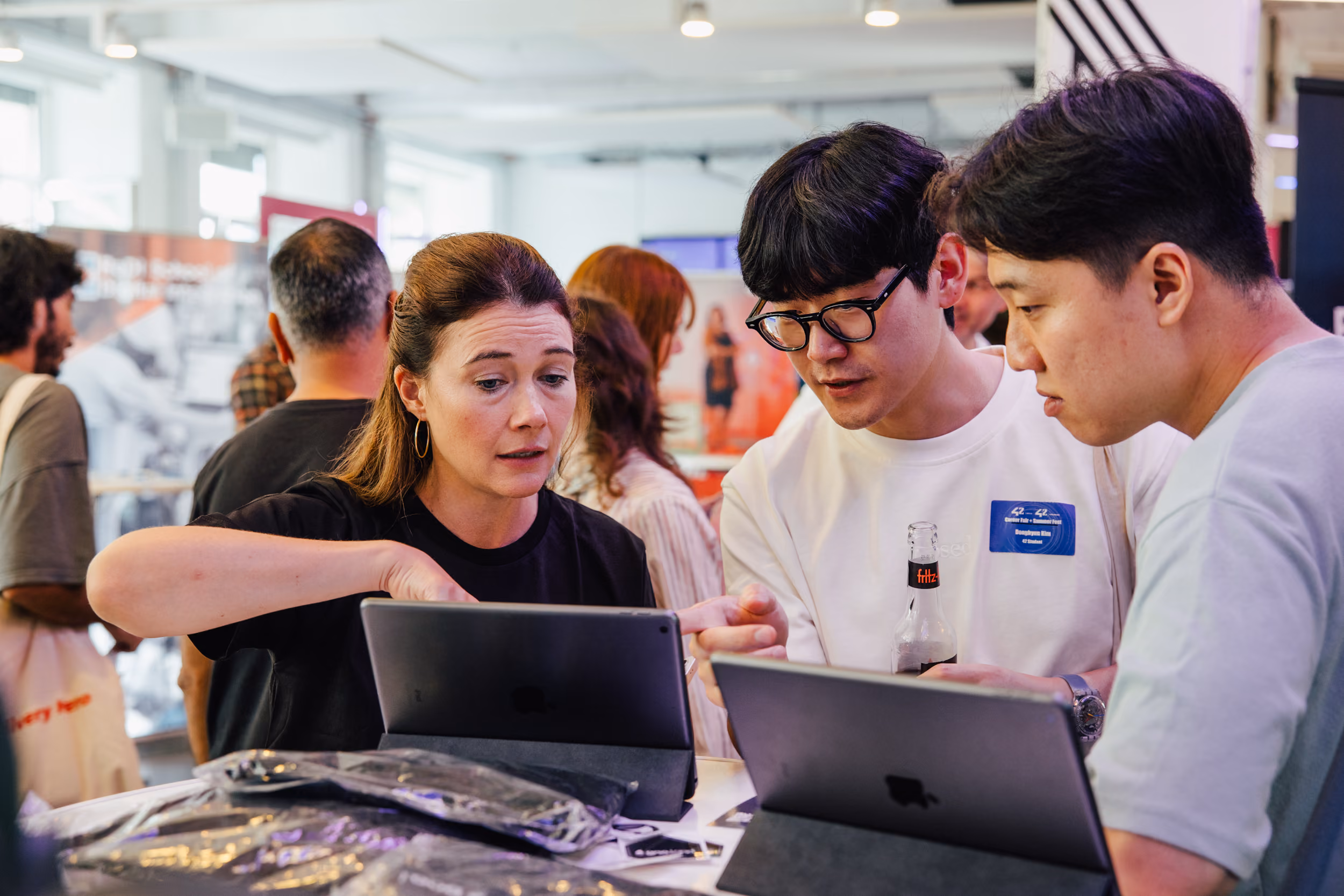 Students engaging with company booths