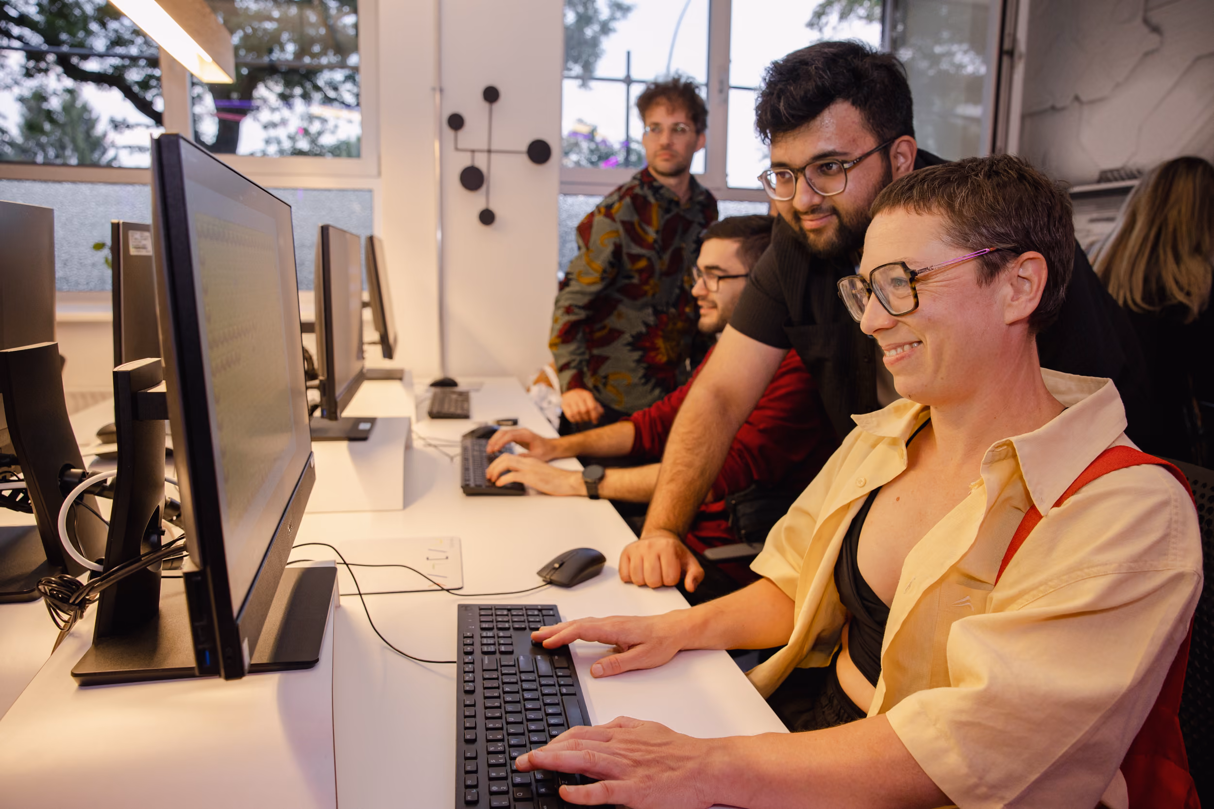 Students working together at the 42 Berlin computer clusters