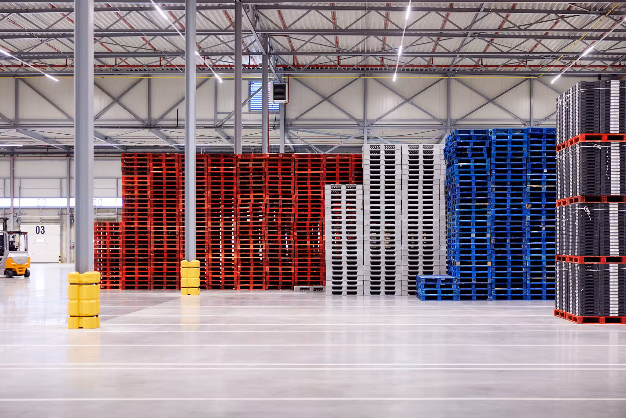 Warehouse with stacked pallets