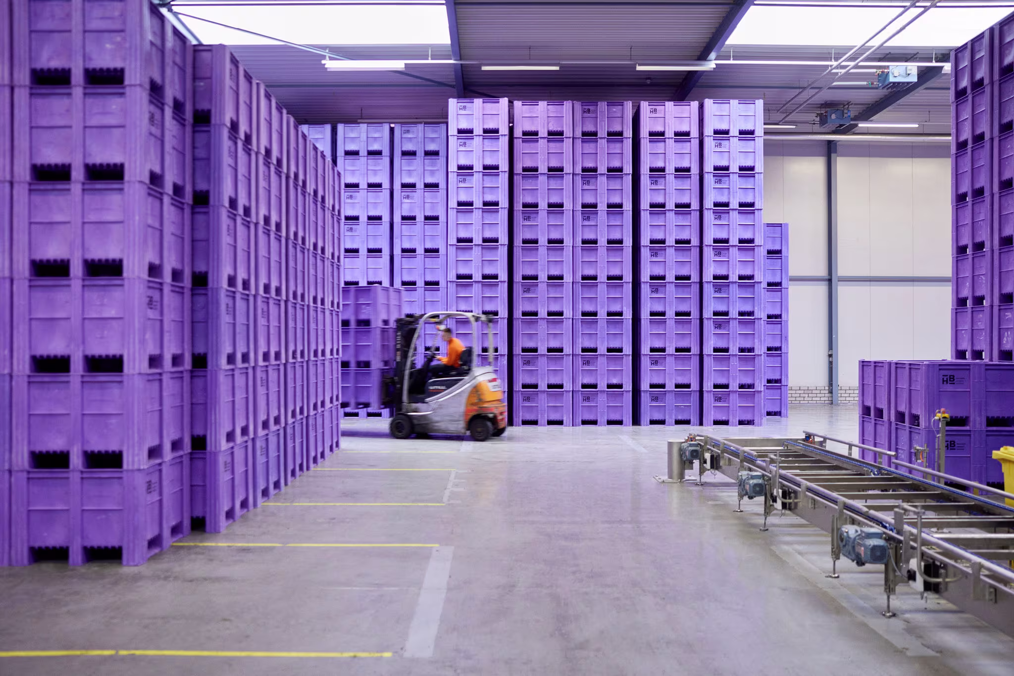 Stacked plastic crates in warehouse
