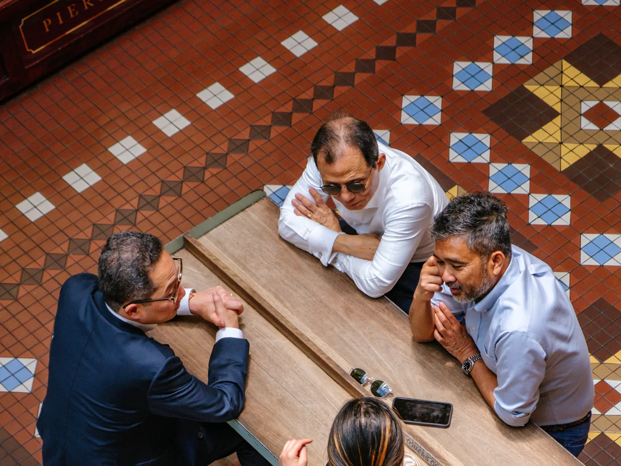 Team meeting around a table to discuss business goals