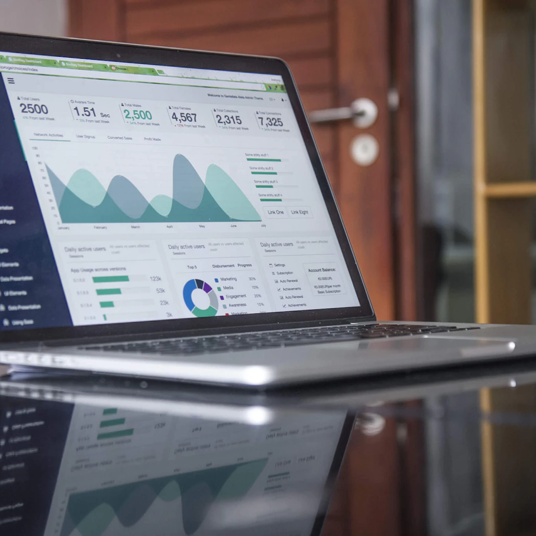 Laptop showing a spending dashboard with charts