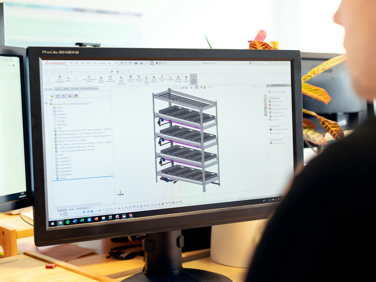 Engineer reviewing an infrastructure diagram on a monitor