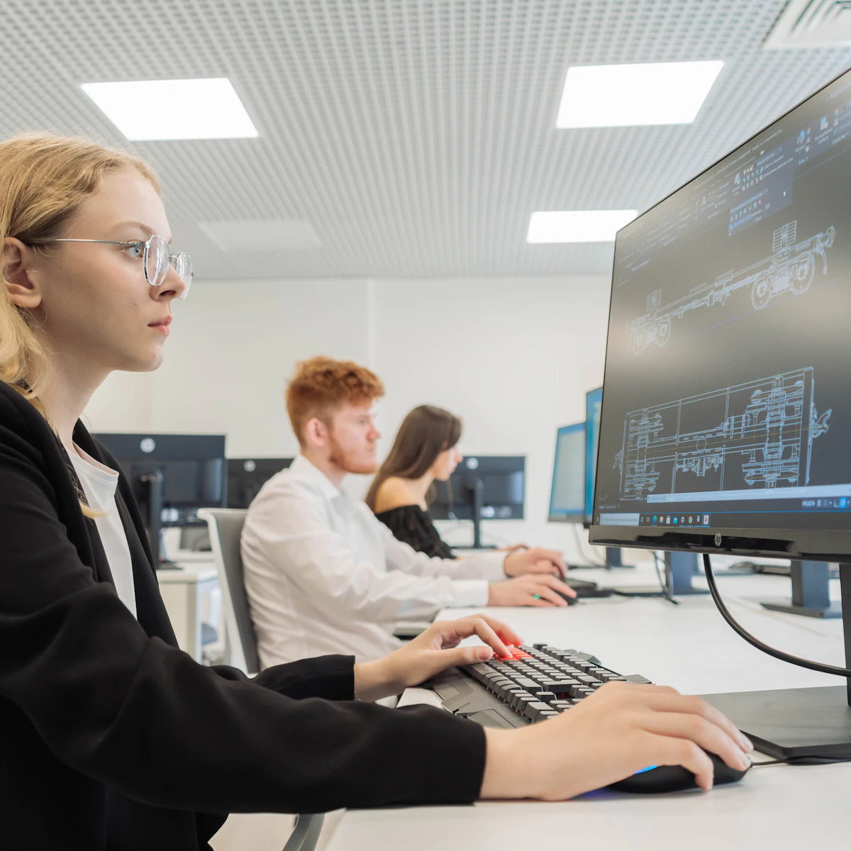 Students working at computers in a modern campus computer lab