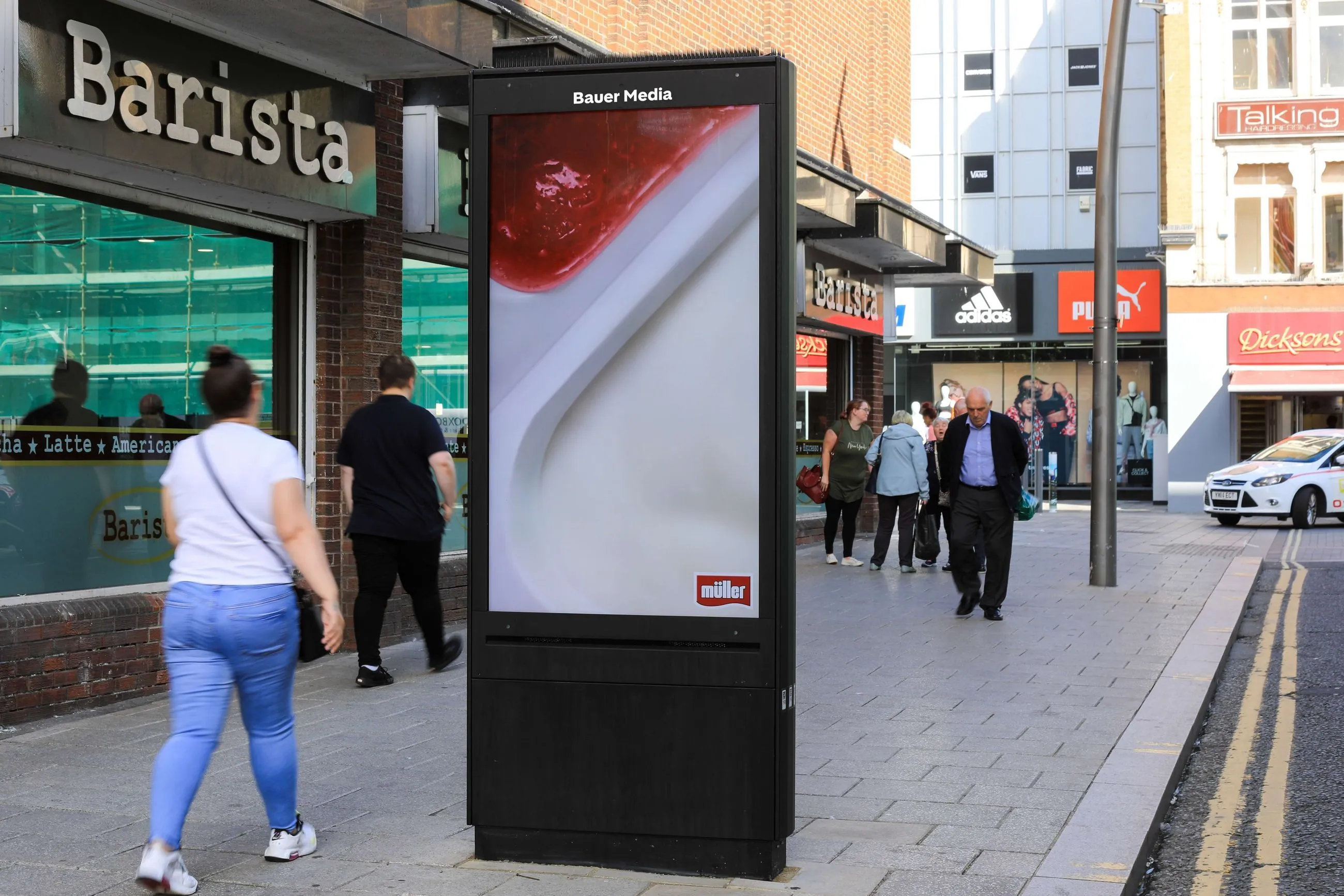 Muller Corner advertising their brand campaign on a roadside digital screen