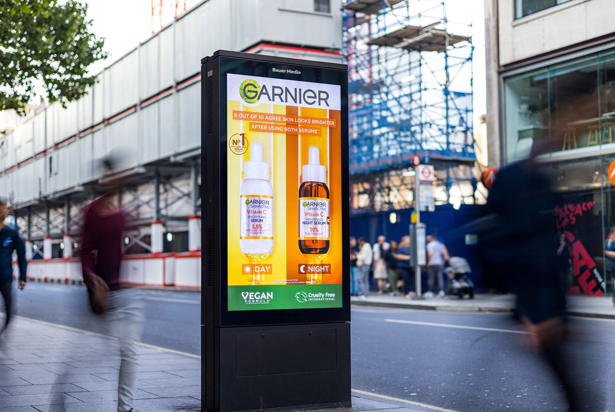 Garnier advertising beauty products on a roadside digital screen