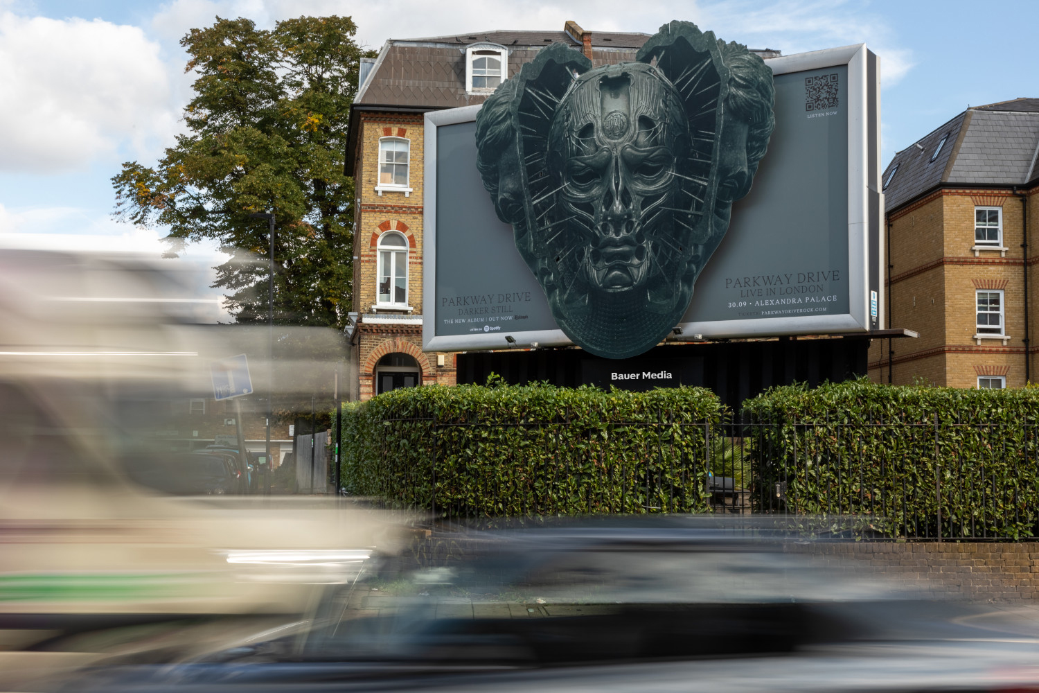 Example of a Create AR campaign with a face appearing to pop out of the billboard