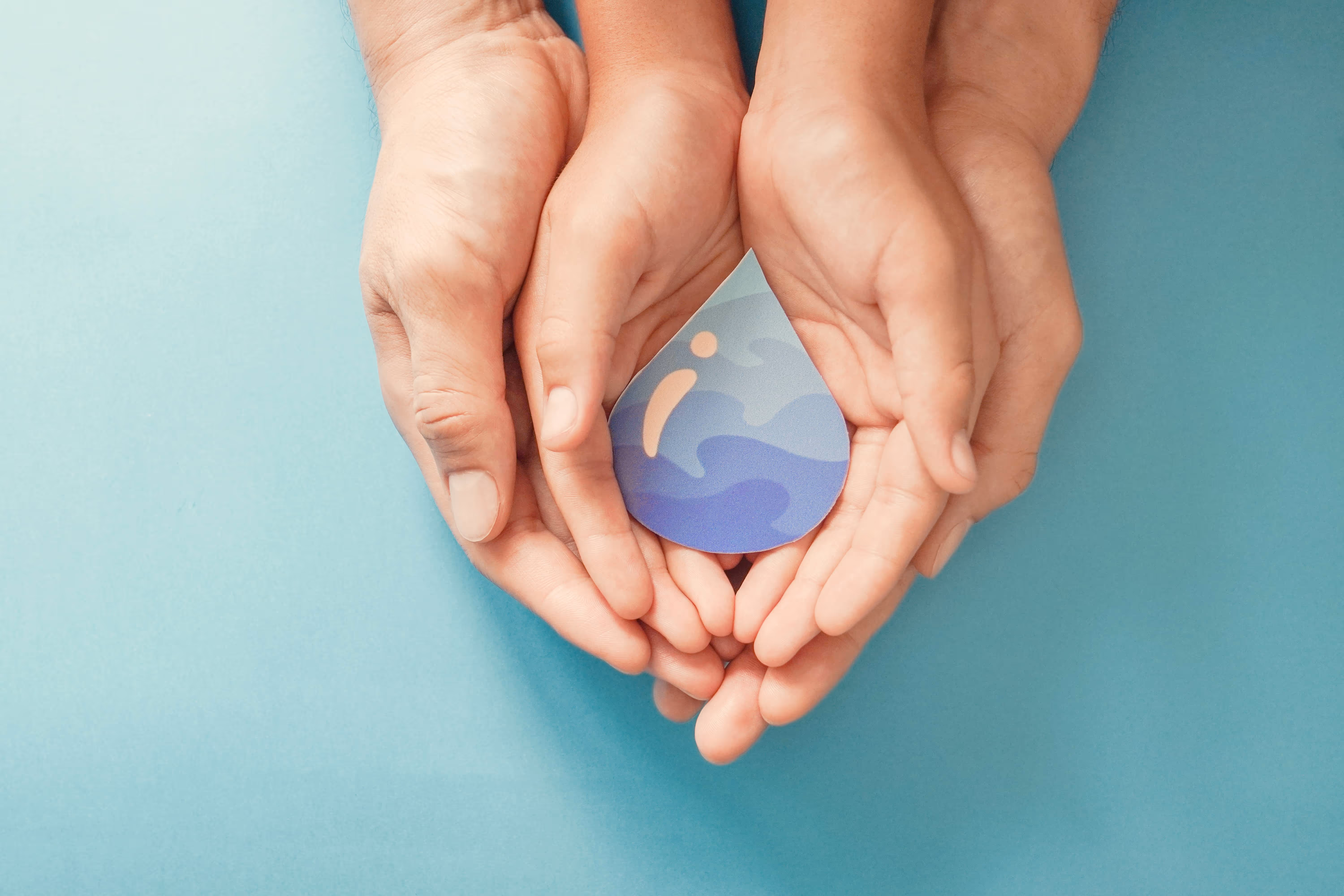 hands holding clean drinking water