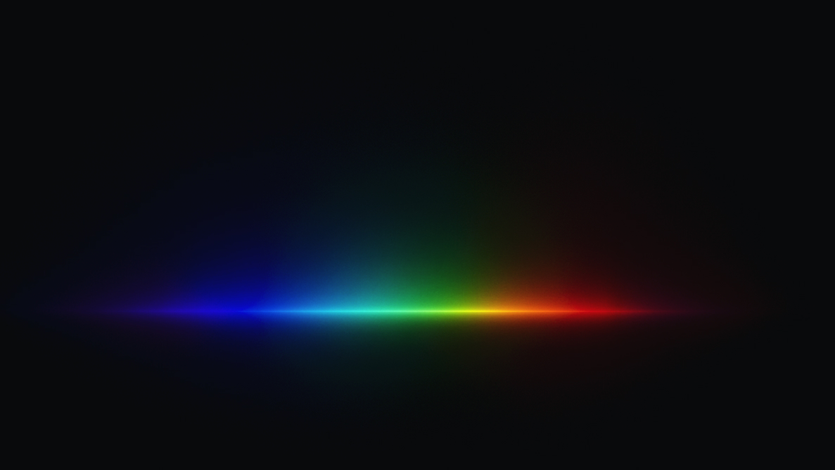 Colour spectrum light beam on a black background.