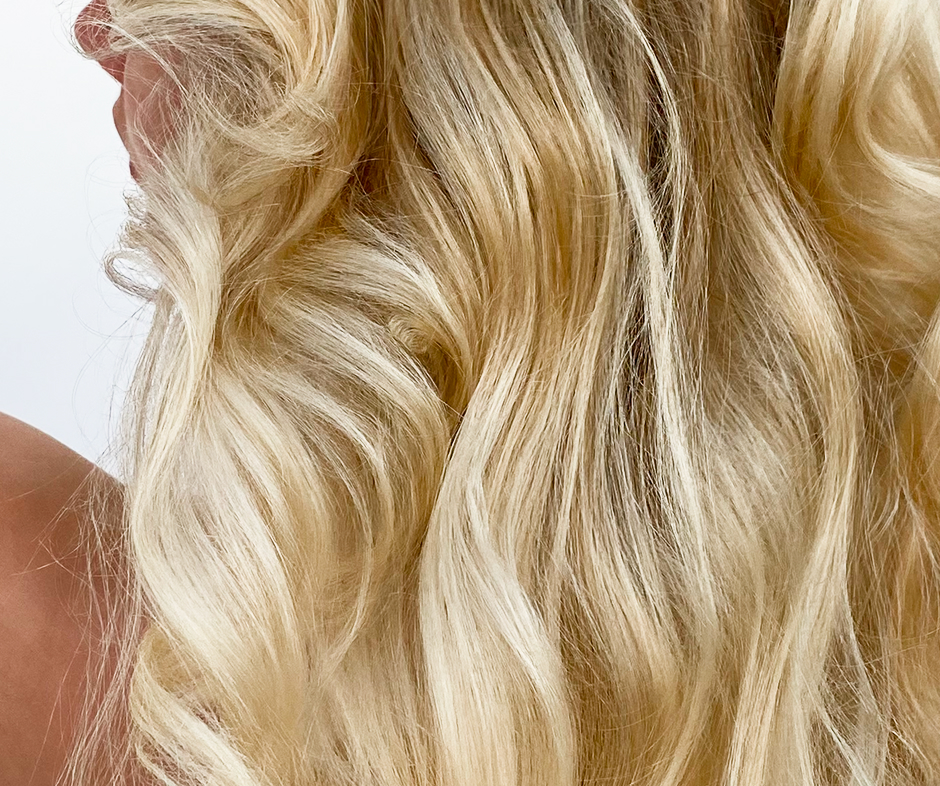 Close-up of long, wavy blonde hair.