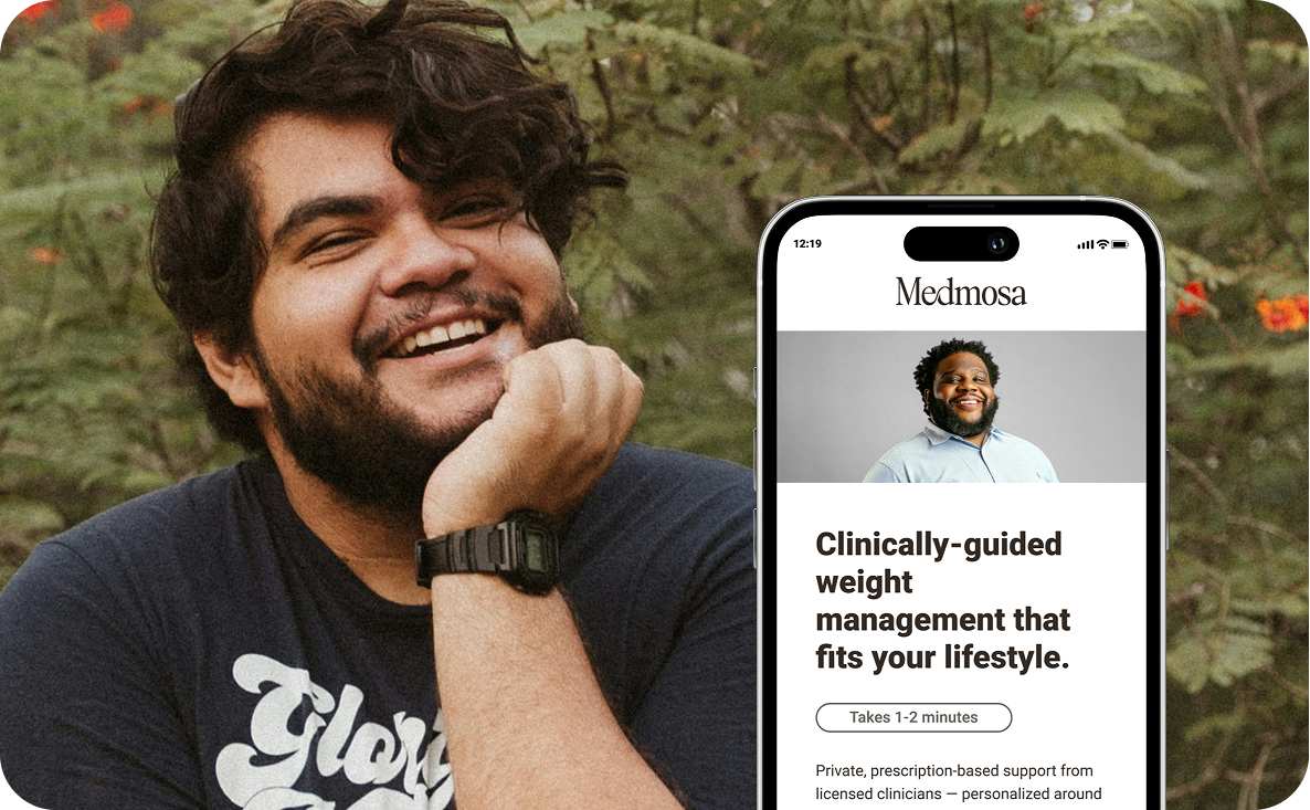 Smiling man with curly hair and beard resting his chin on his hand outdoors next to a smartphone displaying Medmosa app for clinically-guided weight management.