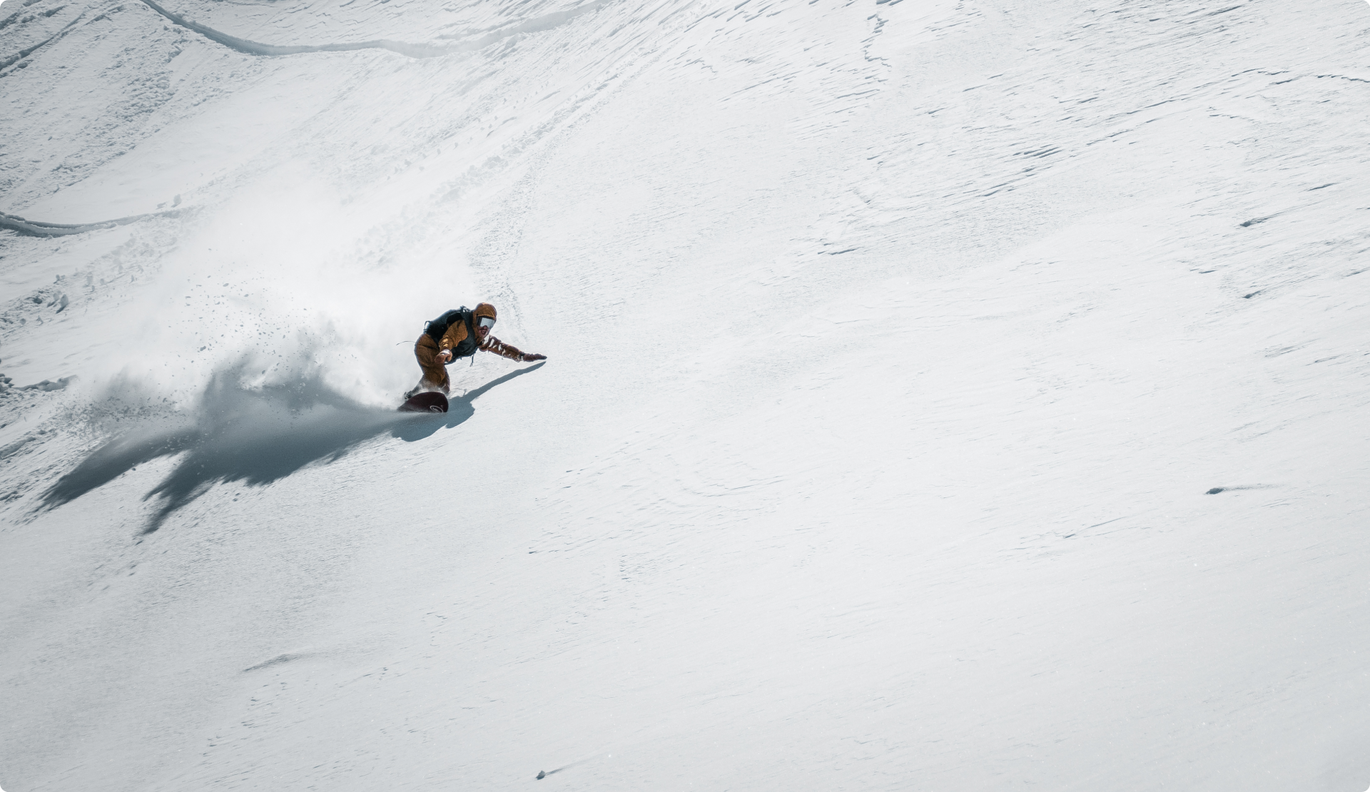Elevated Surfcraft founder, Aaron, riding the Log in deep snow.