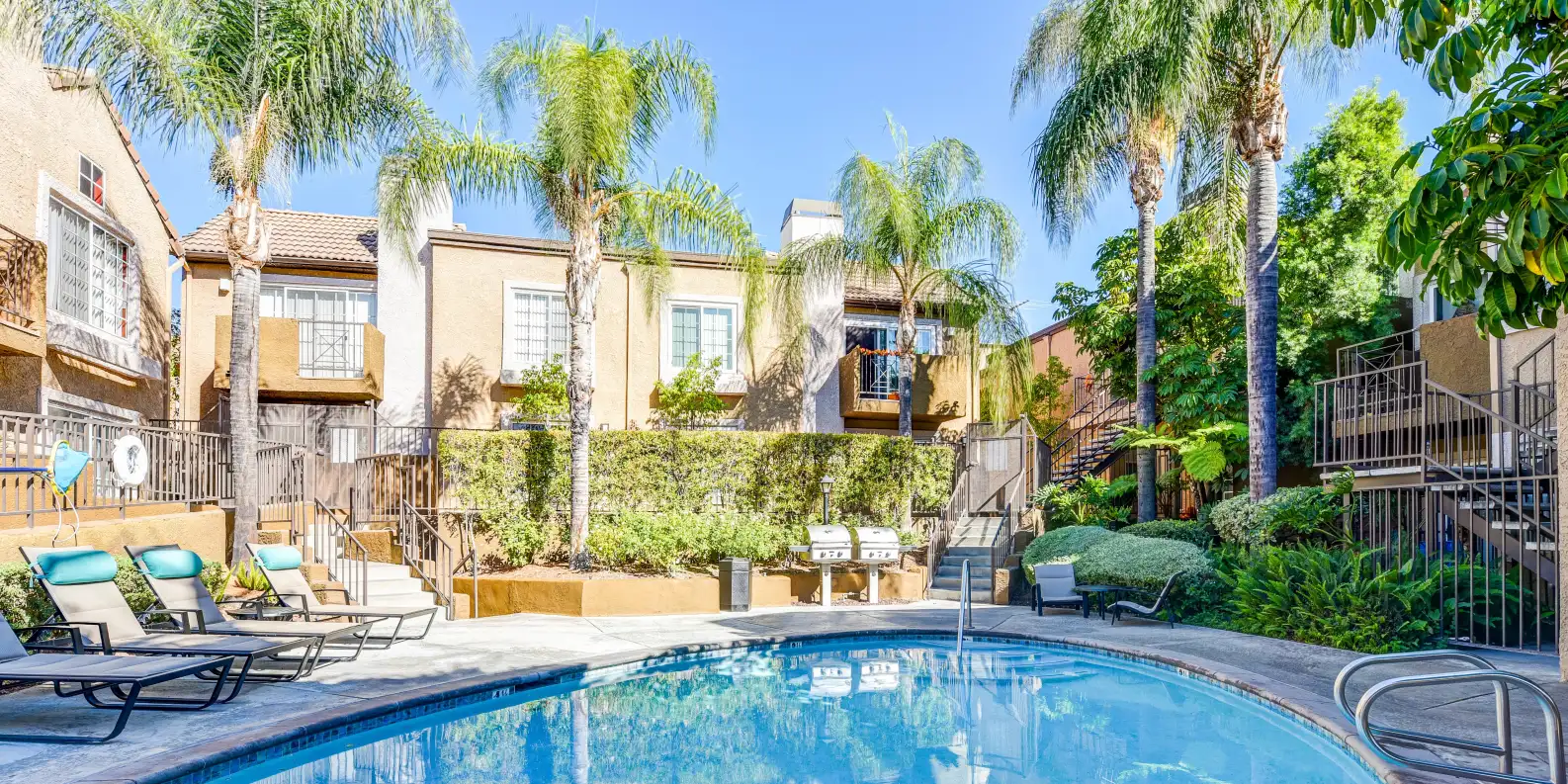 swimming pool with lounge chairs and 