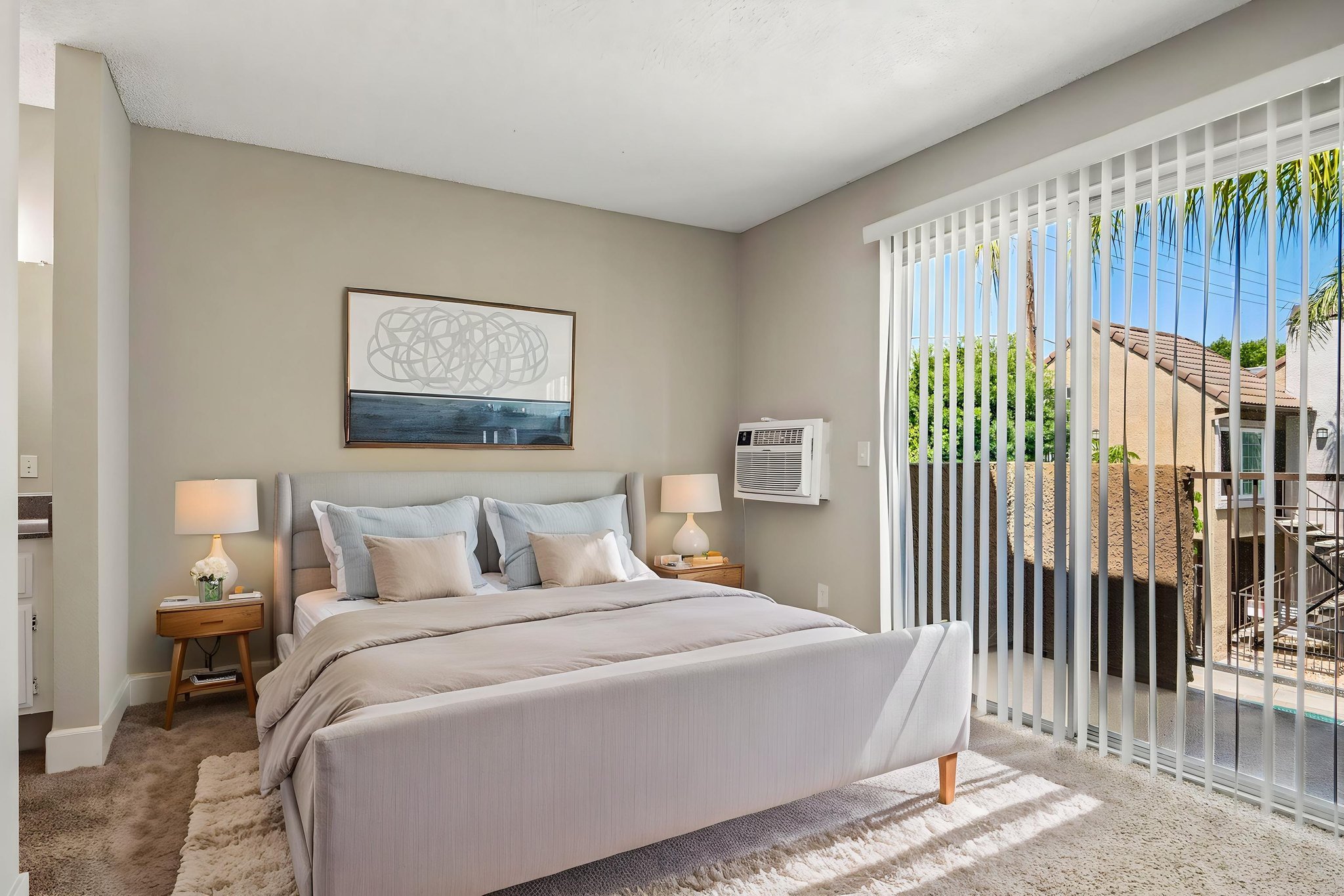 bedroom with bed and large window