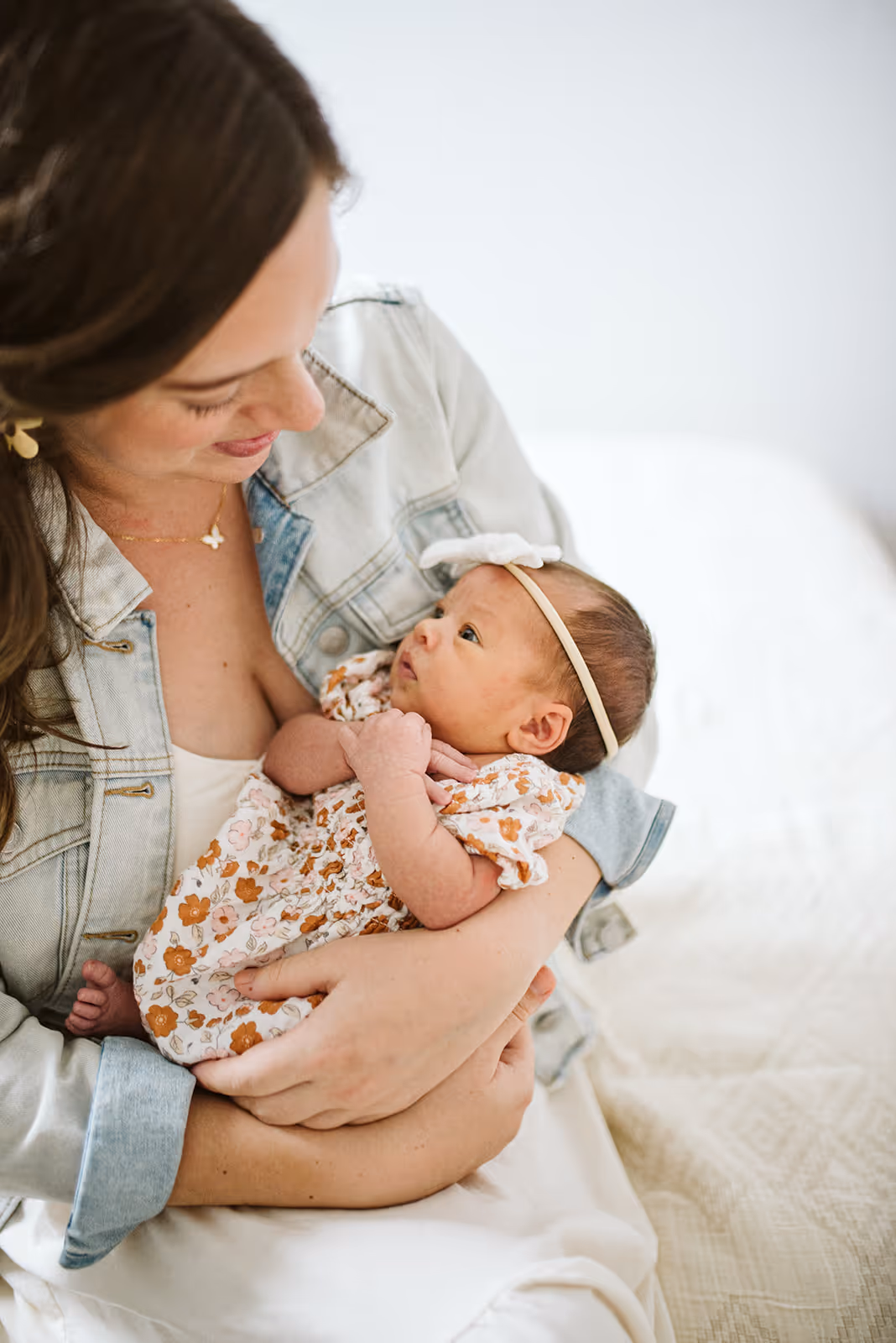 a woman holding a baby