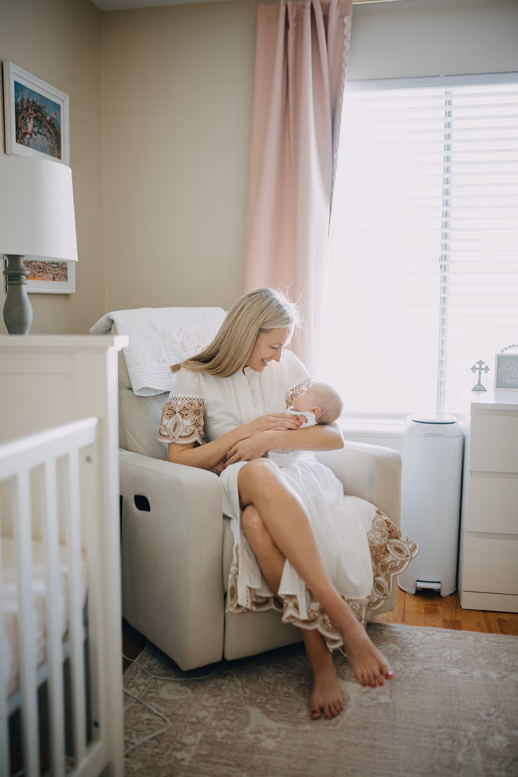 a woman holding a baby