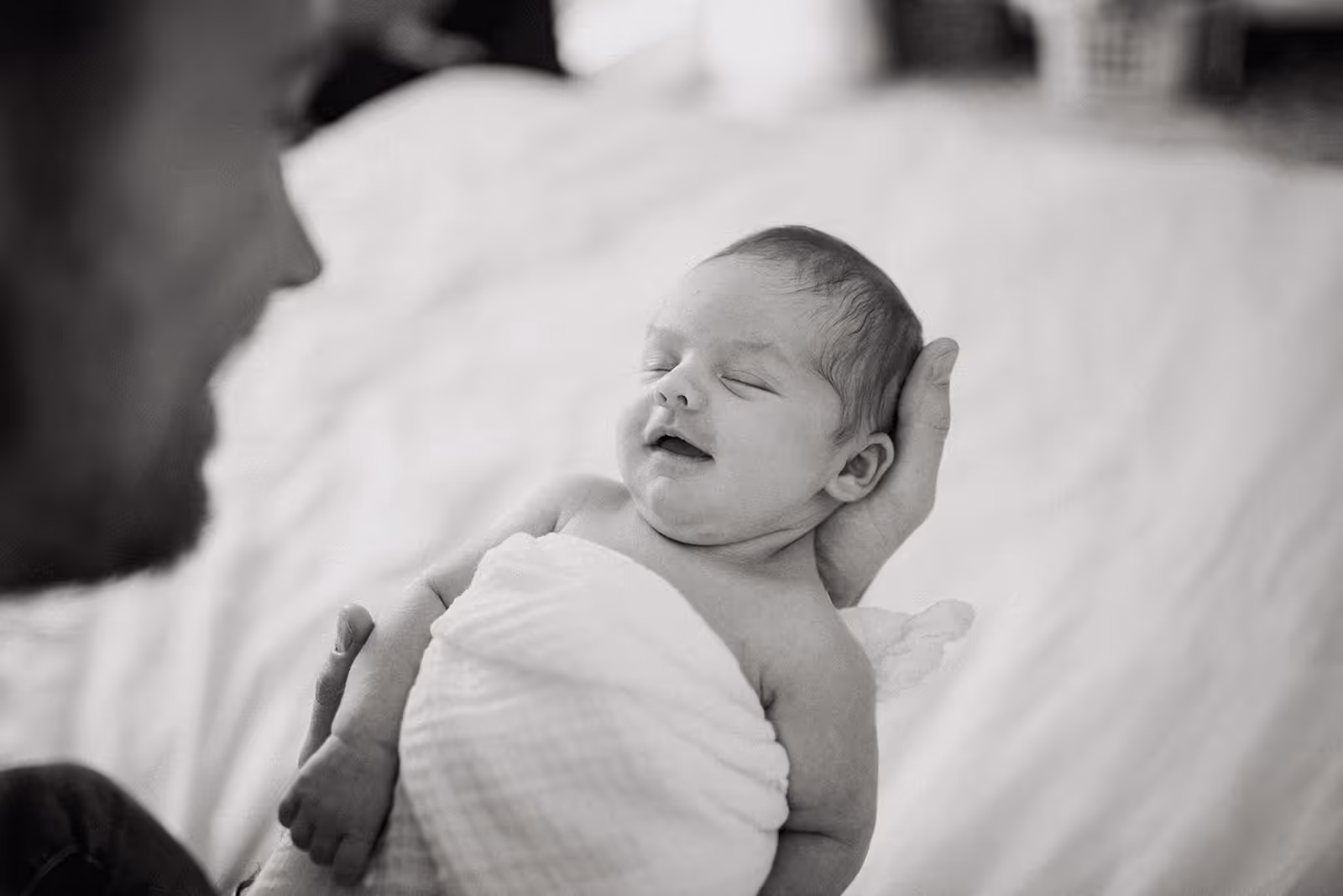 a baby wrapped in a blanket