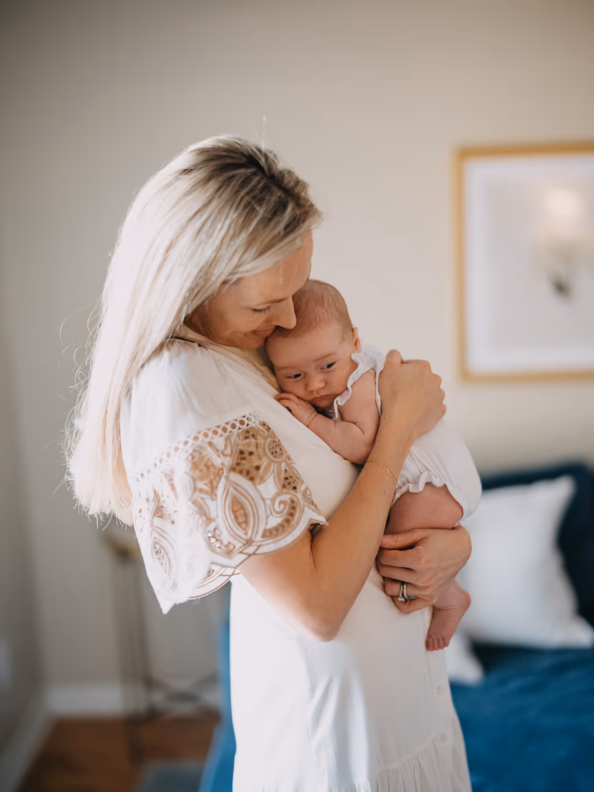a woman holding a baby