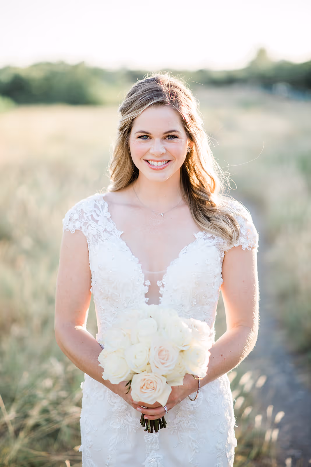 a woman in a white dress holding a bouquet of flowers