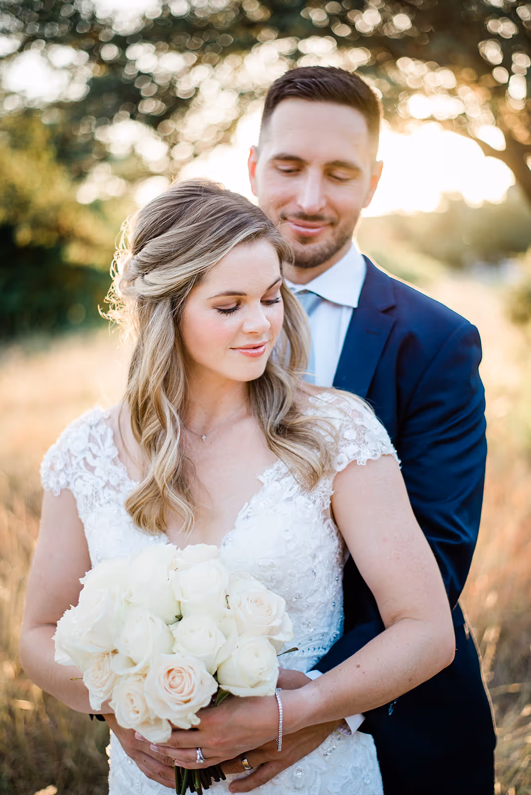 a man and woman holding flowers