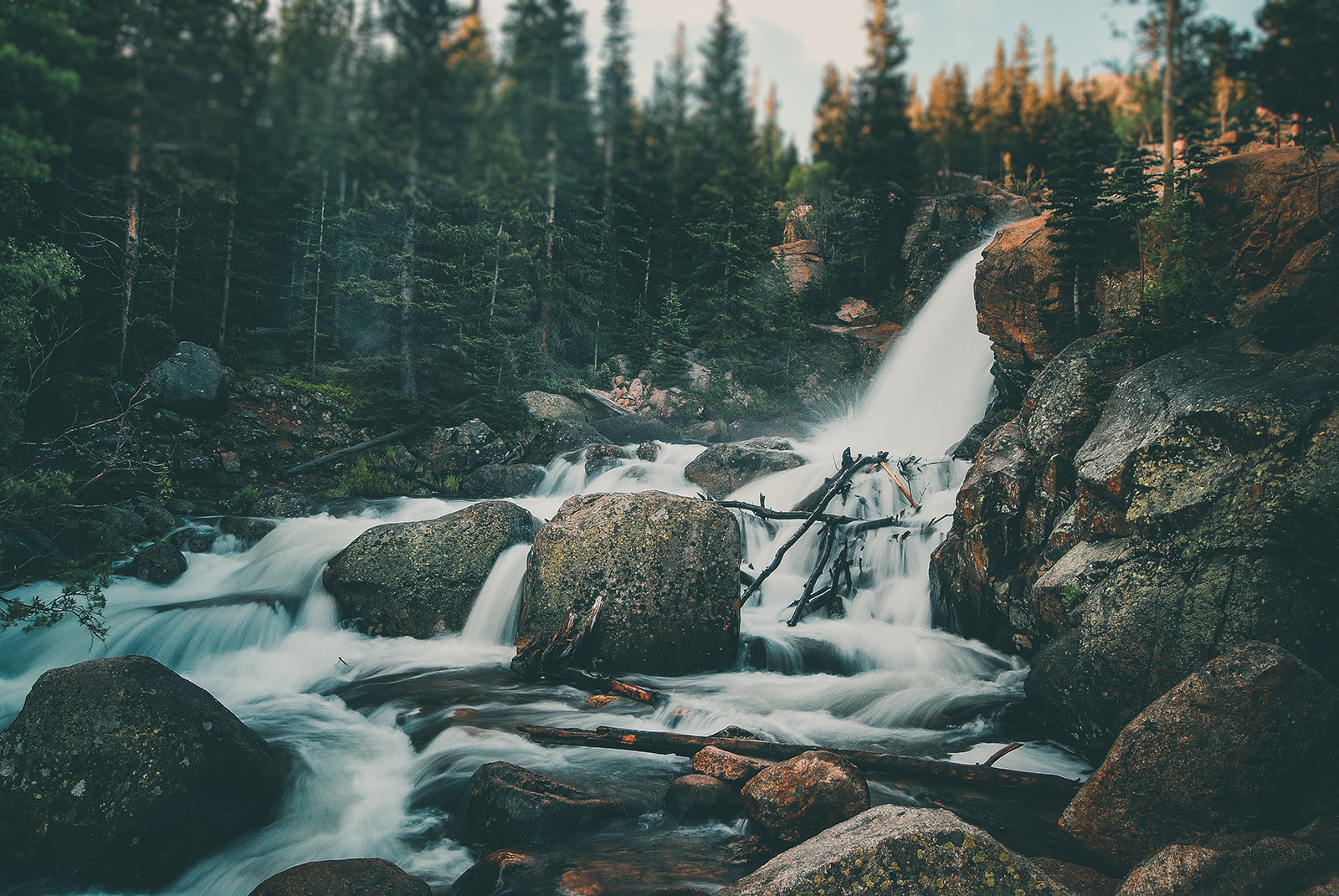 a waterfall in a forest