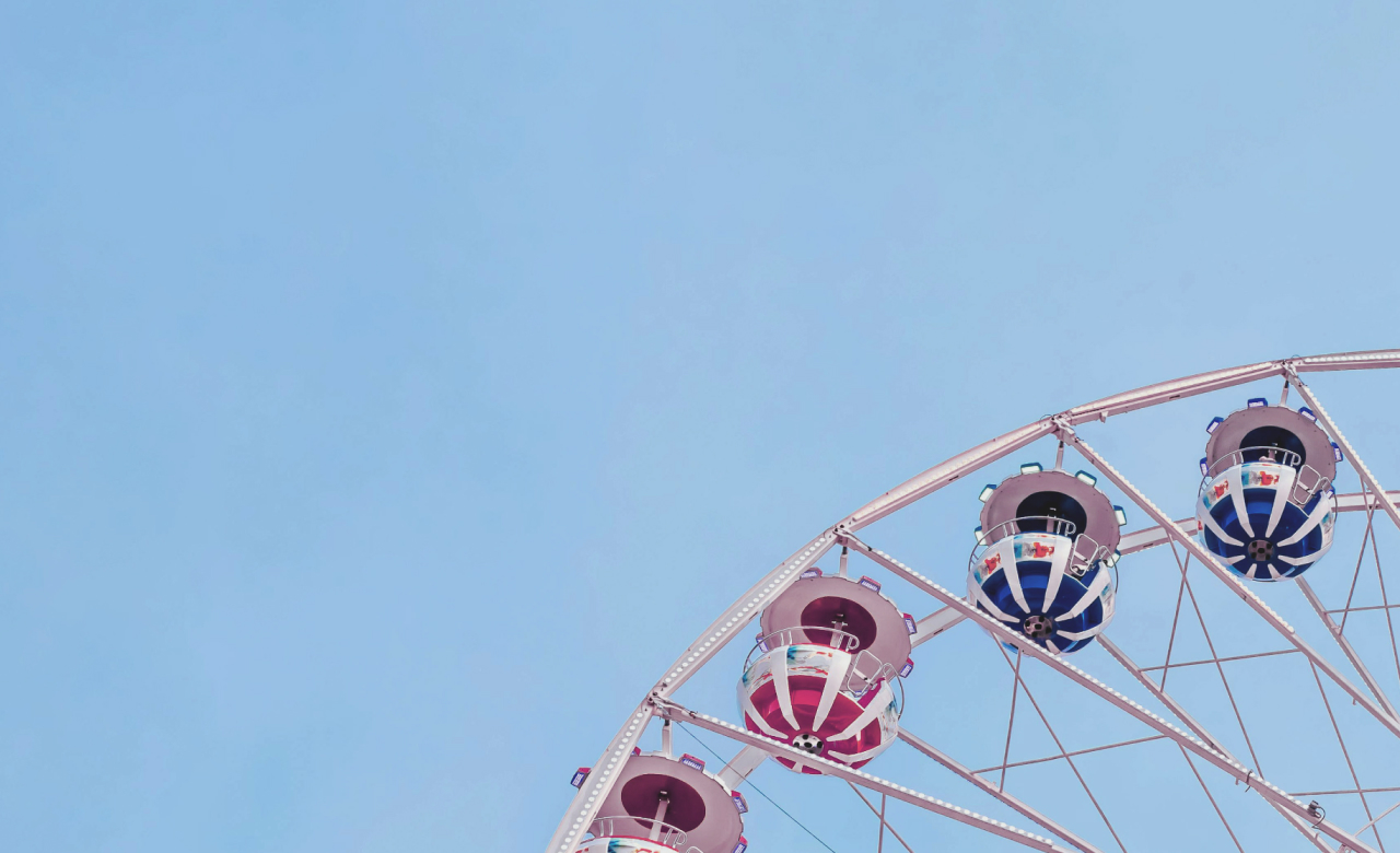 A close up of the top of a ferris wheel.