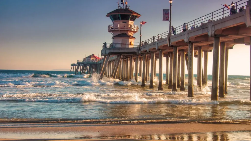 Plumber fixing corroded pipes in a Huntington Beach home.