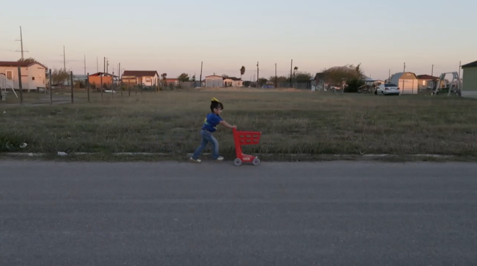 November 6, 2018. A 6-year-old girl plays in the streets as the sun sets, before her neighborhood goes completely dark. This colonia in Alamo, Texas awaits installation of public lights scheduled for January 2019.