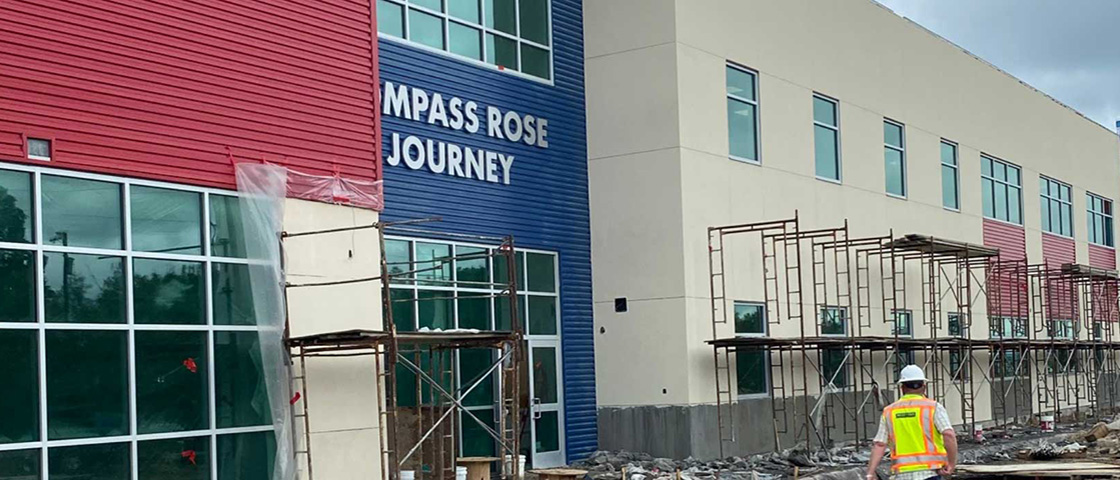 Compass Rose Journey school in Windcrest, Texas, a modern campus featuring indoor classrooms and a 5,000-square-foot outdoor learning environment for K-6 students.