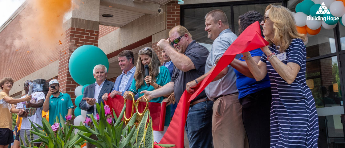 Ribbon-cutting at Mountain View Preparatory, with staff, students, and community celebrating the new academic facility.