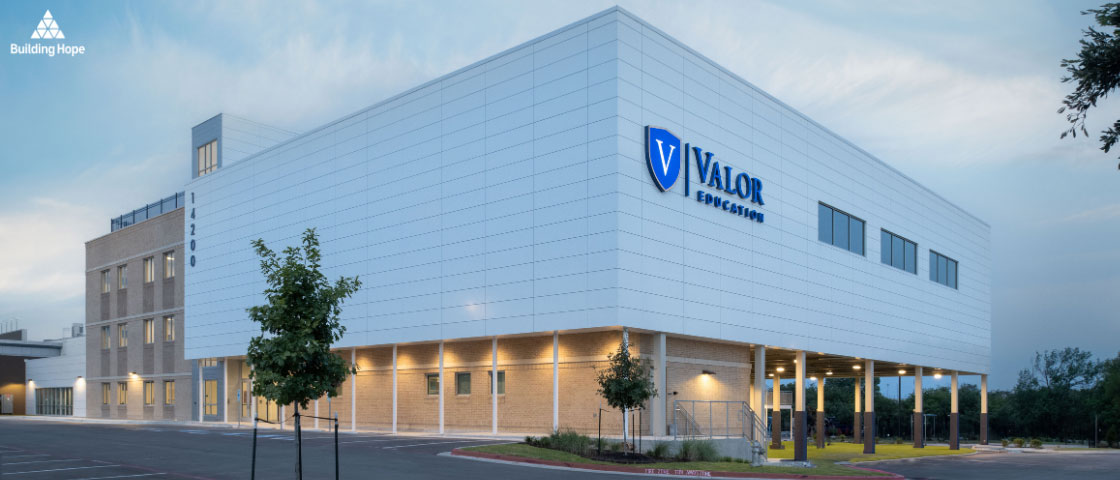 New academic building and green spaces at Valor North Austin, with students and staff celebrating the grand opening.